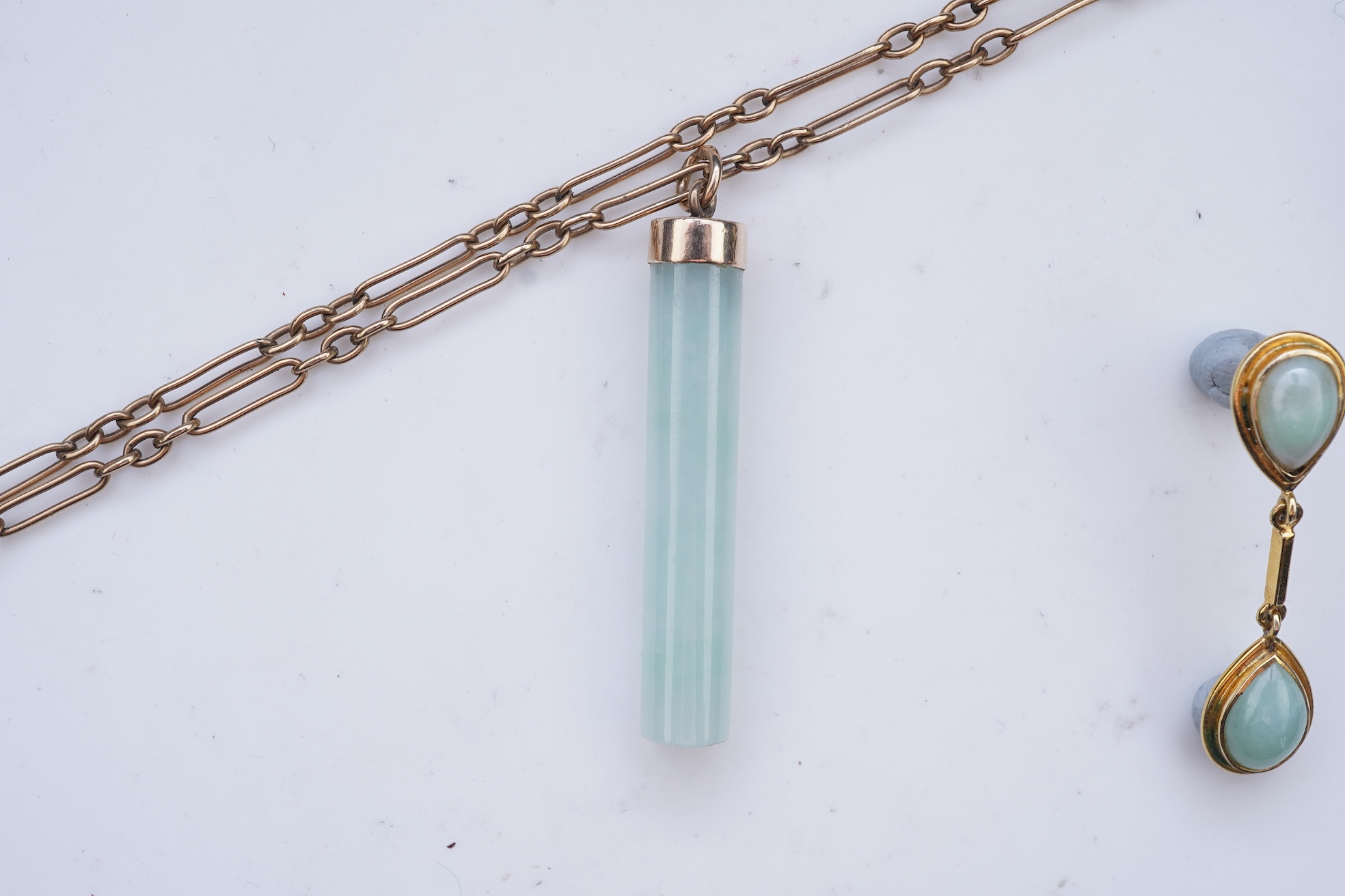 A jadeite pendant and pair of earrings